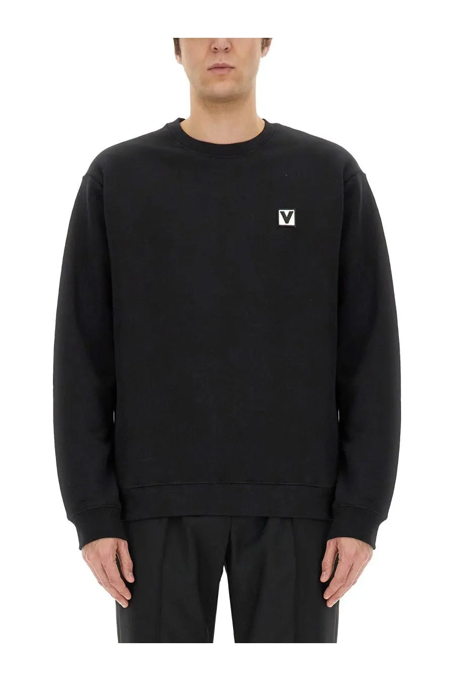 Valentino men’s black cotton crewneck sweatshirt with small white embroidered logo on left chest front side