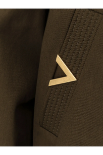 Gold-tone triangular pin on dark brown textured fabric of valentino men’s cotton green jacket
