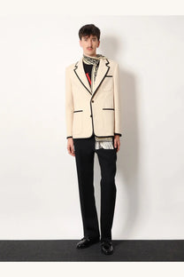 Valentino men’s cream-colored cotton blazer with black trim and two-button closure