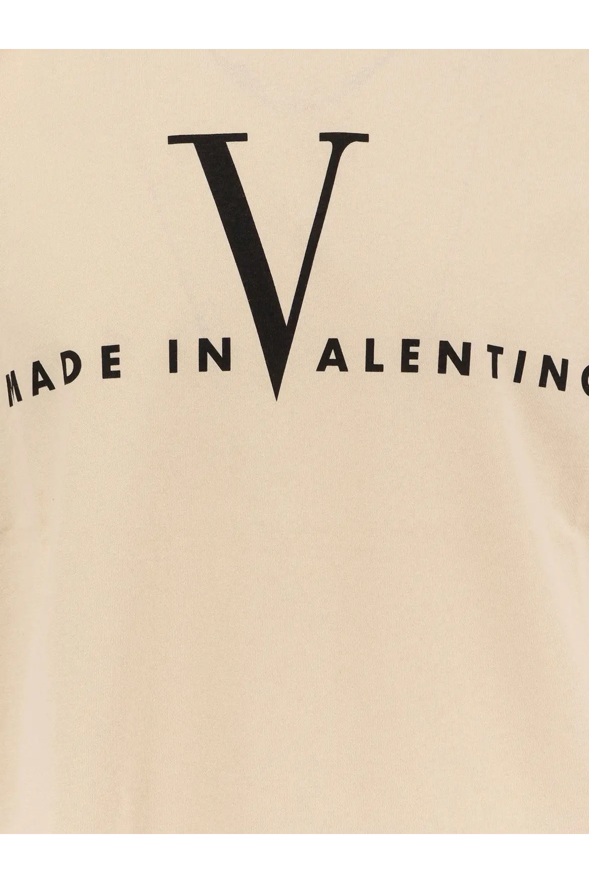 Cream-colored Valentino men’s cotton t-shirt with bold black V logo and made in Valentino text printed beneath it