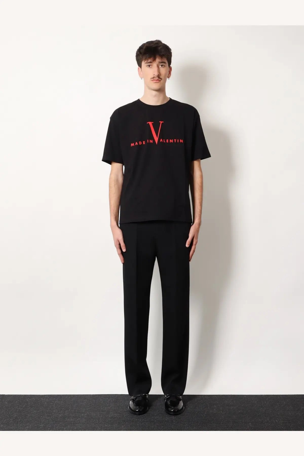 Valentino men’s black cotton t-shirt with bold red v logo and made in valentin text on the chest