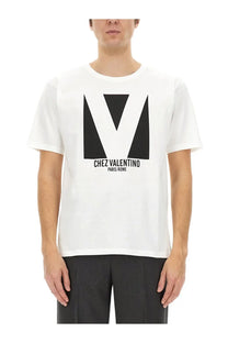 Valentino men’s white cotton shirt with bold black geometric v logo and chez valentino paris rome text below