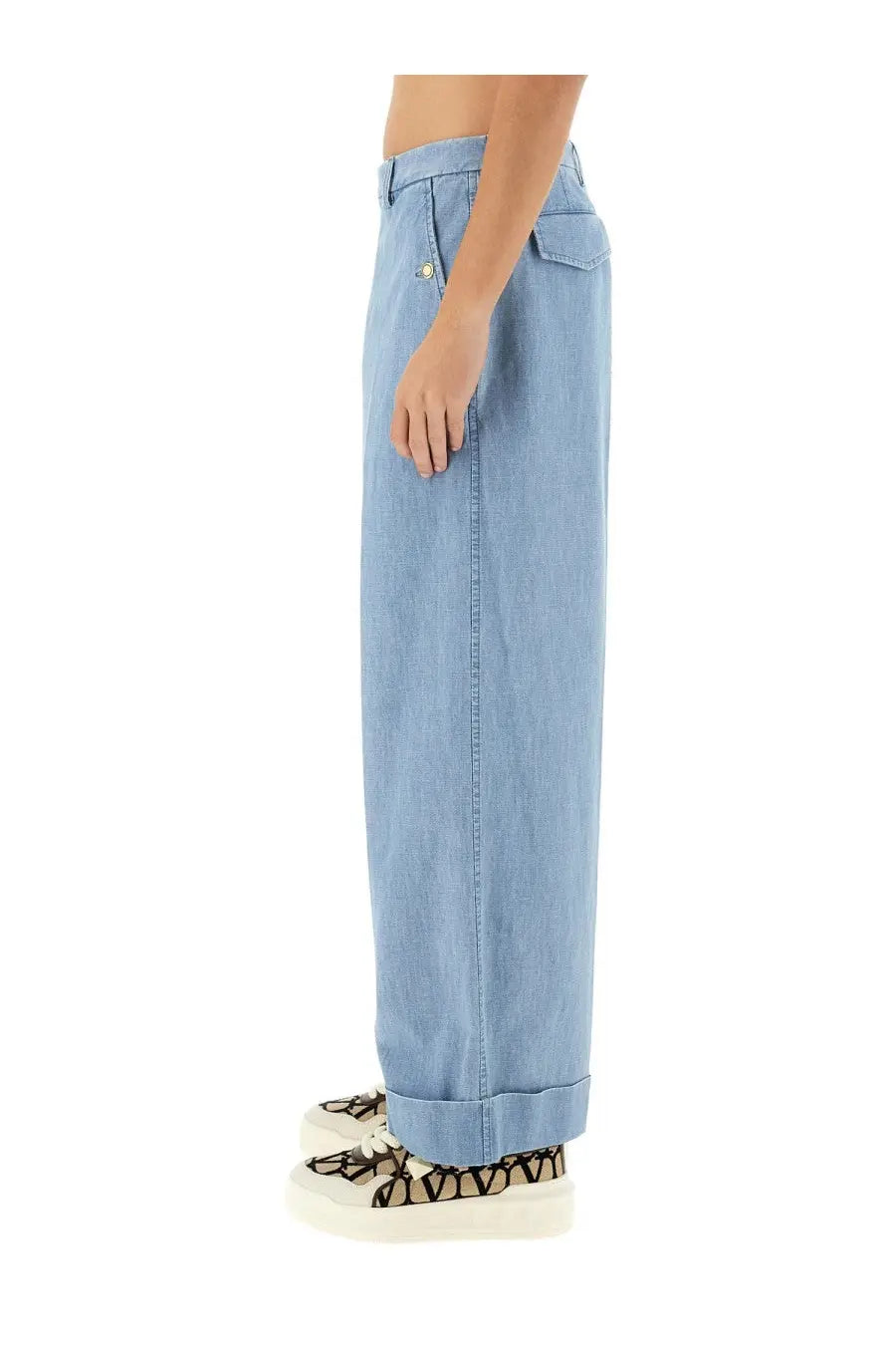 Valentino men’s light blue denim pants with a relaxed wide-leg cut and rolled cuffs for casual wear