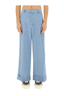 Valentino men’s denim pants in light blue with a wide-leg cut and rolled cuffs made from denim fabric