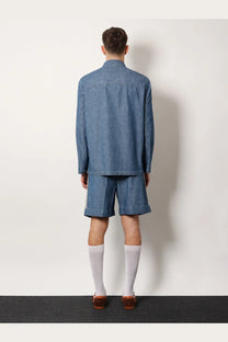 Valentino men’s denim Sahariana jacket in blue with rolled cuffs paired with matching denim shorts