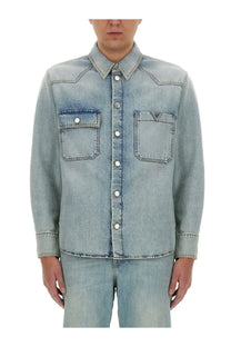Valentino men’s light-wash denim button-up shirt in blue with two chest pockets and subtle v-shaped logo on right pocket