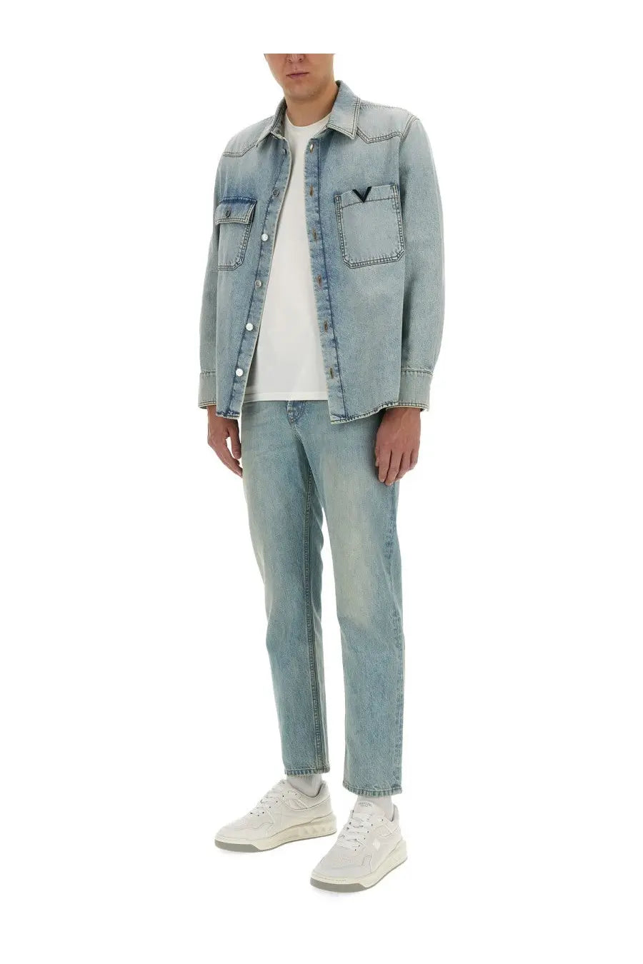 Valentino men’s denim shirt blue featuring light-wash denim with classic button-up design and subtle stitching details