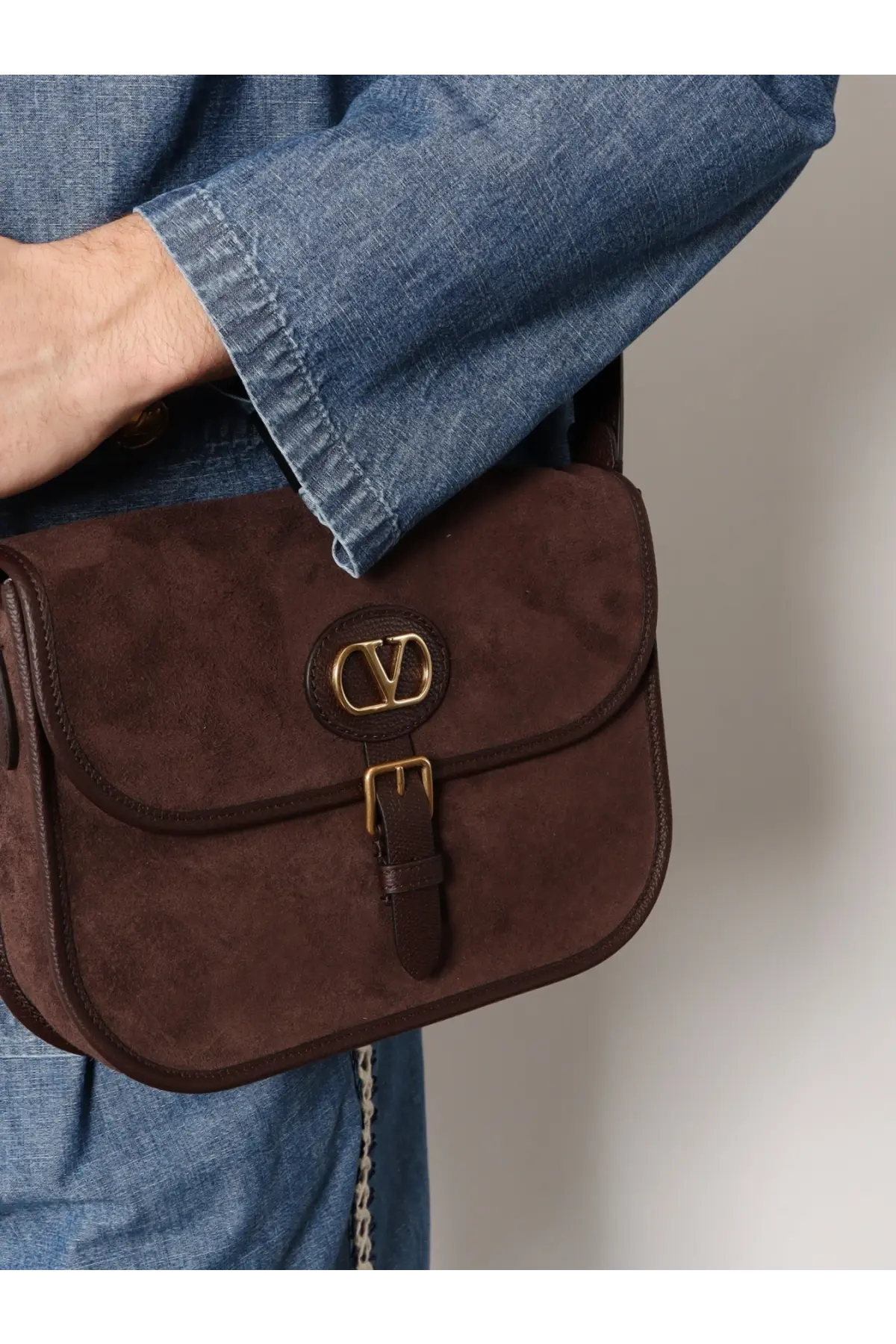 Brown suede Valentino men’s shoulder bag with gold-tone logo clasp and leather strap from Valentino Garavani Gold