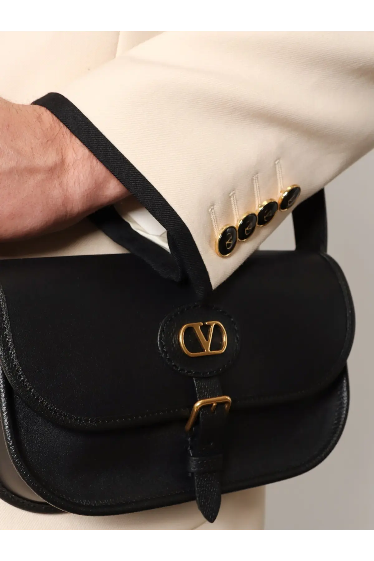 Valentino men’s valentino garavani black leather crossbody bag with gold-tone logo clasp and buckle