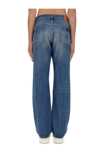 Back side of Valentino men’s blue denim jeans with faded wash and classic back pockets
