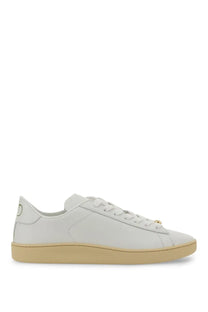 Valentino men’s white leather low-top sneaker with beige rubber sole and gold-tone eyelets