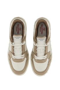 Valentino men’s low top sneaker freedots white in beige and white perforated leather with chunky rubber soles