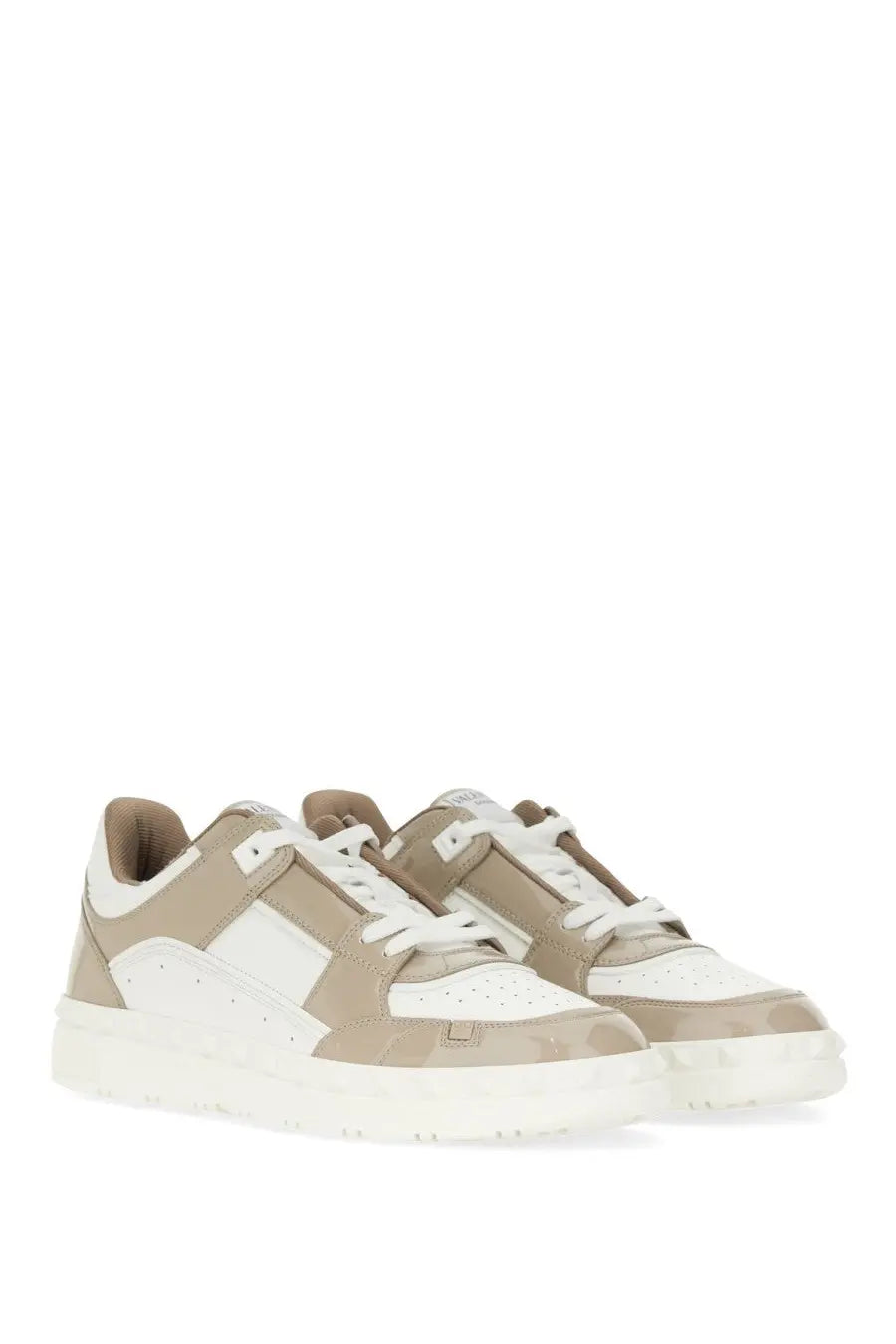 Valentino men’s low top sneaker freedots white beige and white perforated leather with chunky sole and contrasting stitching