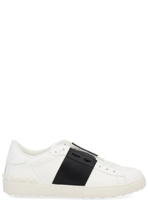 Valentino men’s open sneaker white leather with a bold black panel featuring two circular cutouts and stitching