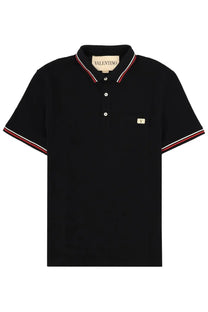 Black Valentino men’s polo shirt with red and white striped trim and embroidered logo patch on left chest