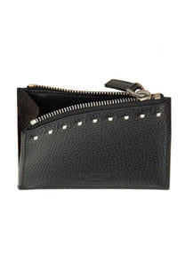 Valentino men’s rockstud card holder in black textured leather with silver-toned studs and metallic pull tab along zipper line