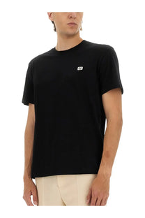 Valentino men’s black short-sleeved crew neck t-shirt with a small white logo patch on the left chest