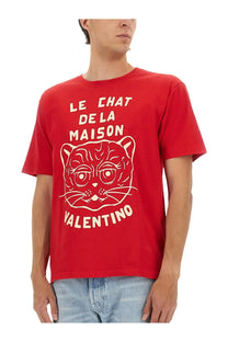 Valentino men’s red t-shirt featuring white line-art cat illustration with le chat de la maison text design