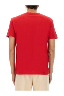 A vibrant red short-sleeved cotton t-shirt with a classic crew neck from valentino men’s shirt red collection