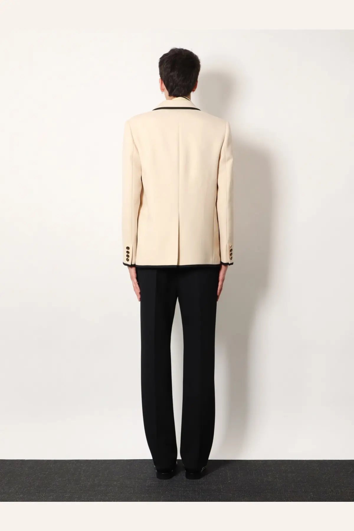 Valentino men’s cream-colored single breasted virgin wool blazer with black trim and structured silhouette
