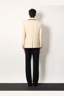 Valentino men’s cream-colored single breasted virgin wool blazer with black trim and structured silhouette