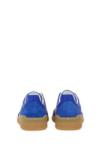 Valentino men’s low top sneaker in blue suede with tan rubber sole and white laces for casual wear