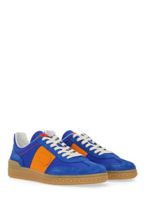 Valentino men’s low top sneaker in vibrant blue and orange suede with white laces and tan rubber sole