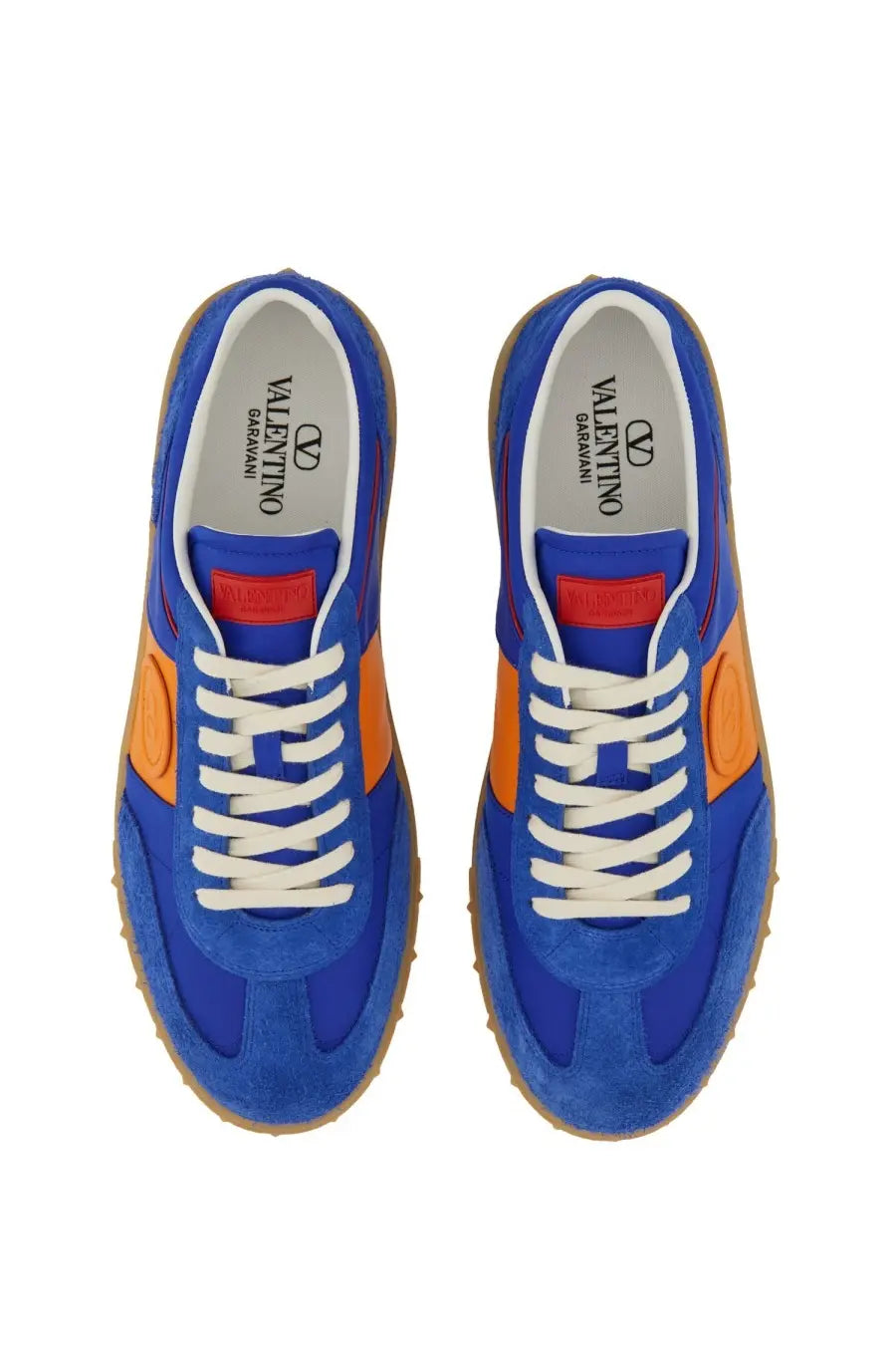 Valentino men’s low top sneaker in vibrant royal blue and orange suede with white laces and classic athletic design