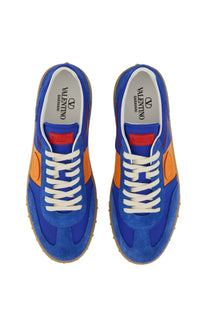 Valentino men’s low top sneaker in vibrant royal blue and orange suede with white laces and classic athletic design
