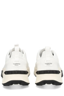 Valentino men’s sneaker true act white with black rubber soles and textured heel detail shown from the back side