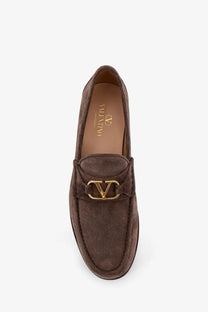 Valentino men’s brown suede loafers with gold-tone v-logo buckle in grey product showcase