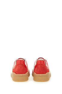 Valentino men’s Upvillage sneaker in red suede and leather with a tan rubber sole low-top design