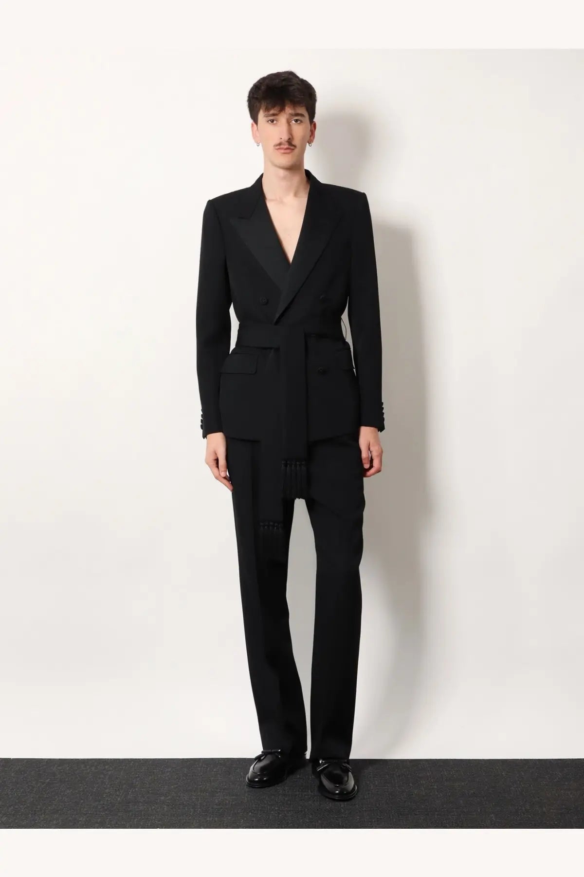 Valentino men’s black virgin wool blazer with notched lapels and belted waist tailored for a sleek fit