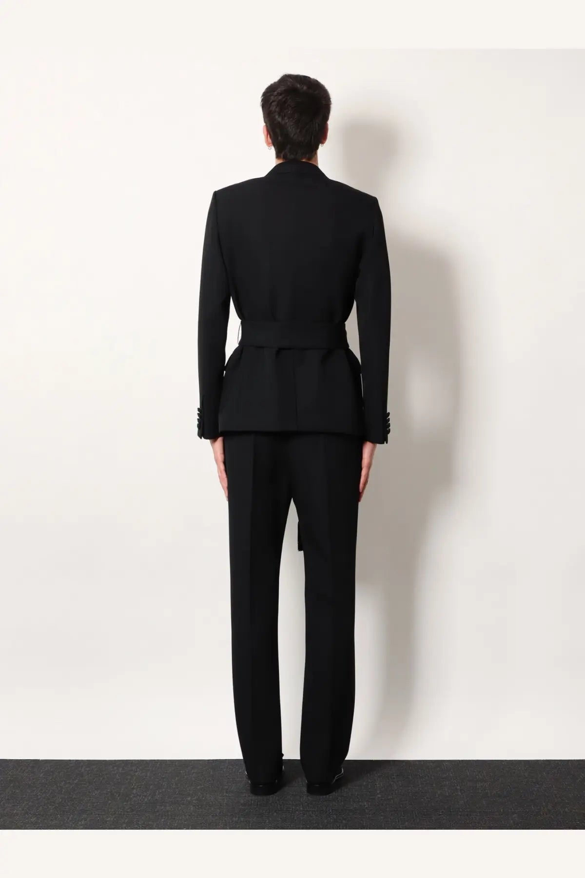 Valentino men’s black virgin wool blazer tailored with a cinched waist and structured shoulders in front view