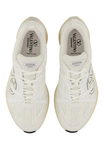 White Valentino men’s Vlogo Easyjog sneaker with silver logo detailing and beige rubber sole in leather and fabric