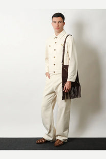 Brown suede fringed shoulder bag with metallic studs complementing valentino men’s white denim jacket white