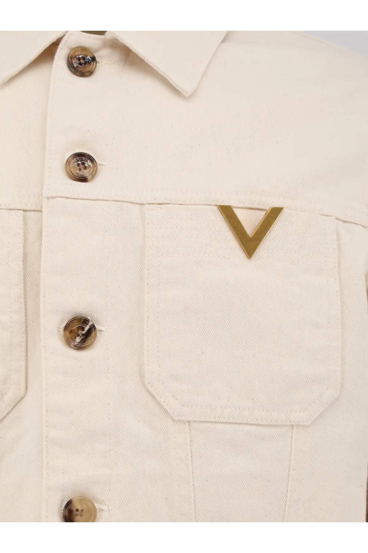 Valentino men’s cream-colored white denim jacket with gold-tone buttons and v-shaped metal logo on chest pocket