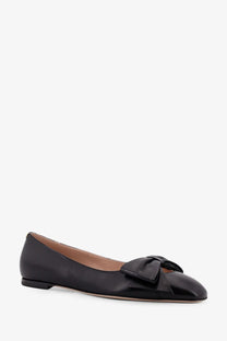 Valentino women’s black leather ballet flat featuring a prominent bow at the toe for stylish comfort