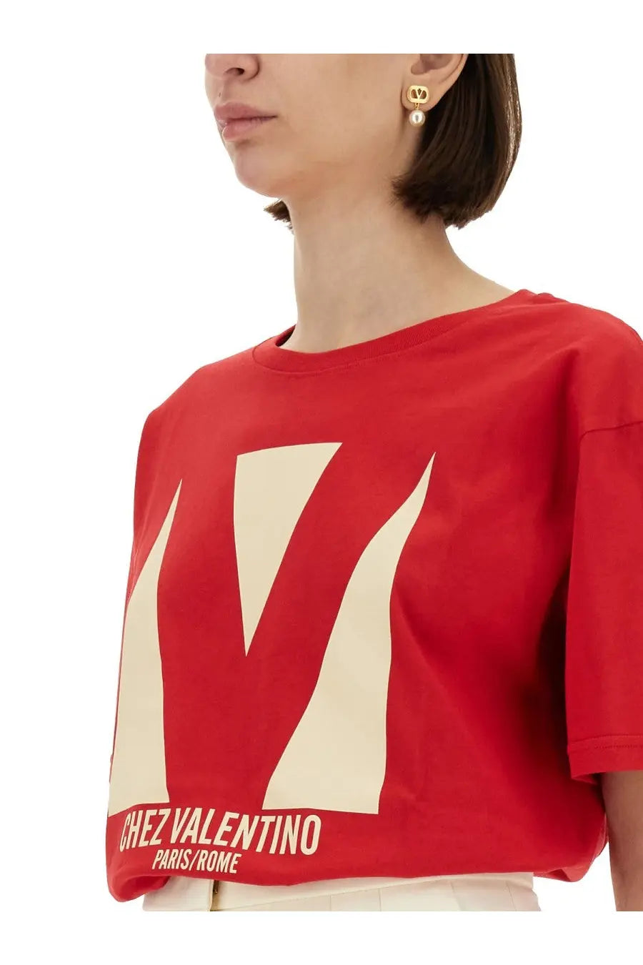 Valentino women’s red cropped t-shirt with cream geometric v logo and chez valentino paris rome text at the hem