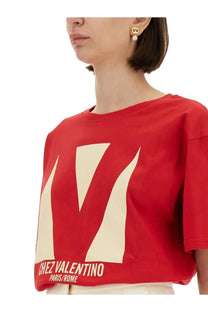 Valentino women’s red cropped t-shirt with cream geometric v logo and chez valentino paris rome text at the hem