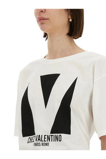Valentino women’s white cotton t-shirt with bold black geometric v logo and chez valentino paris rome text print