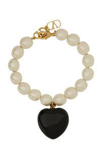 Valentino womens Coeur Royal bracelet with gold tone clasp cream pearls and glossy black heart pendant