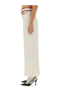 Valentino women’s crepe couture cream-colored wide-leg trousers with a red and gold logo belt detail at the waist