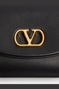 Black leather valentino women’s devain shoulder bag with gold-tone logo clasp and clutch design