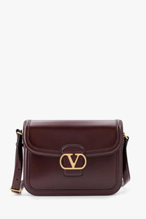 Valentino women’s leather shoulder bag in burgundy with rockstuds and gold-tone hardware for stylish use