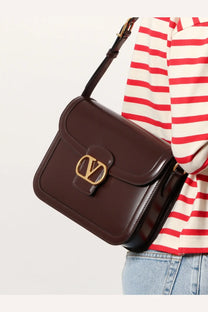 Brown leather Valentino Garavani 9TO5 shoulder bag with gold-tone logo clasp for women