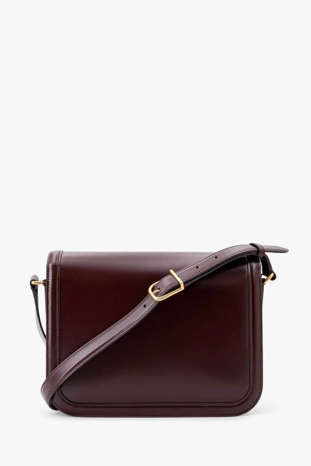 A sleek dark burgundy leather shoulder bag with gold-tone buckle and adjustable strap by Valentino Garavani
