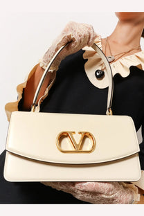 Cream-colored Valentino women’s leather shoulder bag with gold-tone Vlogo clasp in white leather