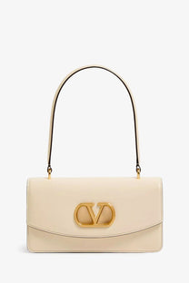 Valentino women’s cream leather vlogo shoulder bag with gold-tone clasp and matching curved handle
