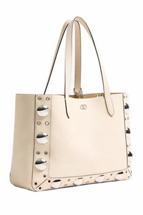 Valentino women’s nellcôte shopping bag in cream leather with silver-toned circular studs along the sides